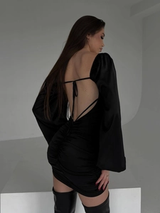 Elegant black backless mini dress with bell sleeves and ruched detail back view