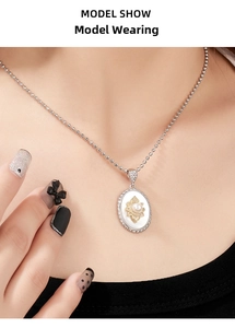 Detail view of 925 silver necklace with pearl and oval mother-of-pearl pendant on model