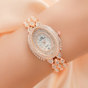 Elegant rose gold women's quartz watch with full diamond setting and oval dial