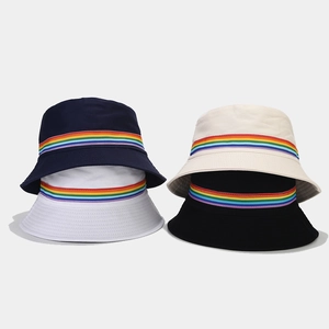 Rainbow stripe reversible bucket hats for women in navy, beige, white, and black colors