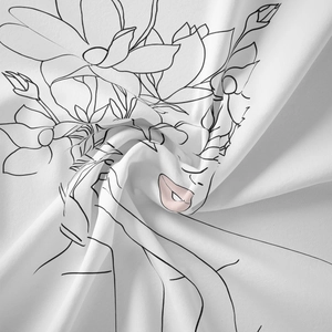 Detailed view of the smooth line art fabric texture with minimalist floral female face