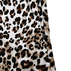 Close-up of leopard print satin fabric showing the hidden black side zipper detail