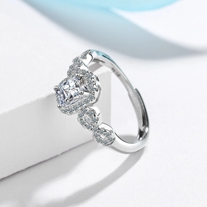 Elegant silver ring with square-cut center stone and infinity symbol band design