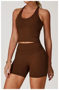 Detail of dark coffee yoga set featuring a U-neck vest and high-waist shaping shorts