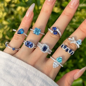 Elegant S925 silver ring with blue heart zircon and ice-cut gemstones on hand