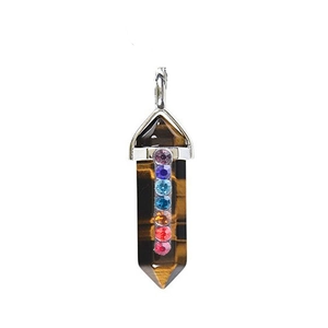 Close-up of a tiger eye hexagonal pendant with seven colorful chakra rhinestones