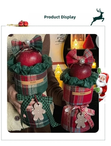 Macro view of Christmas plaid velvet gift box with bow, pearl, and gingerbread man tag