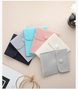 Collection of premium velvet jewelry pouches with snap buttons in elegant Morandi colors