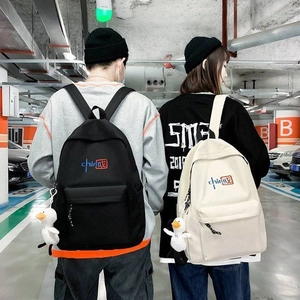 Unisex canvas backpack with China calligraphy and cute duck pendant in street style