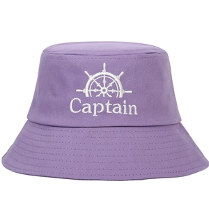 Purple cotton bucket hat featuring white Captain embroidery and a nautical helm icon