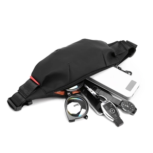 Minimalist black waterproof nylon waist bag with shoulder strap and essentials storage