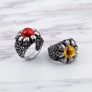 Gothic punk skull rings with red and yellow evil eyes in polished stainless steel