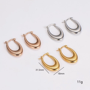 U-shaped earrings with textured stripe design in gold, silver, and rose gold finishes