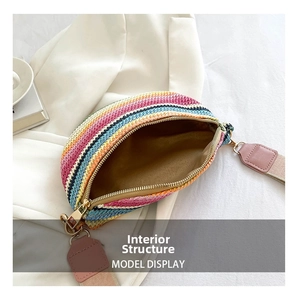 Detail view of colorful bohemian straw fanny pack with wide strap and soft lining