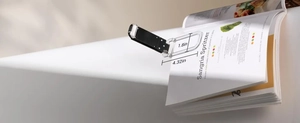 Mini folding book light showing compact 4.32in by 1.8in dimensions for portable use