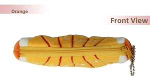 Detail of plush orange slice coin purse with realistic fruit texture and yellow zipper