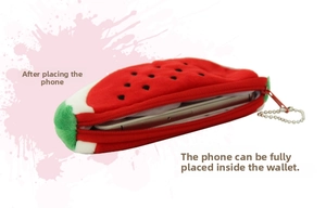 Watermelon plush coin purse with zipper closure and metal chain showing phone storage capacity