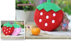 Detail of red plush strawberry coin purse with white embroidery and silver chain hook