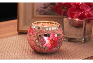 Romantic mosaic glass candle holder with star pattern on a wooden table setup