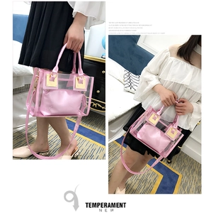 Close-up of pink jelly beach bag with transparent PVC exterior and leather inner pouch