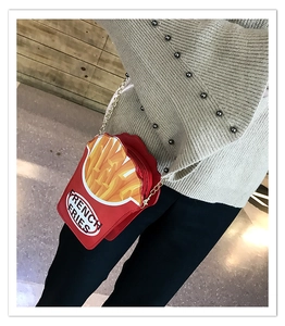 Detail of red French fries crossbody bag with yellow chips and golden chain strap