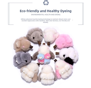Detailed overhead view of plush rabbit charms in multiple colors with fur texture