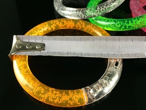 Macro shot of 8cm diameter glow acrylic bubble bracelet with multi-color LED lights