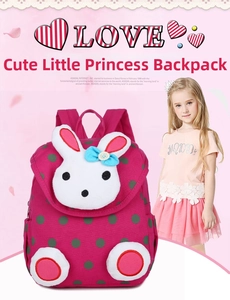 Pink polka dot toddler backpack featuring a plush 3D bunny design with blue bow detail