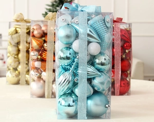 Detail of assorted blue and gold plastic Christmas ball ornaments in festive packaging