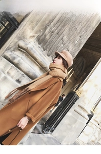 Chic winter outfit featuring camel wool coat with matching mohair scarf and baker boy hat
