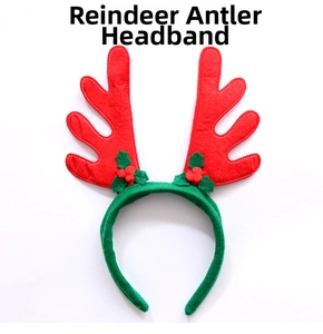 Detail of red Christmas antler headband with green holly leaves and red berry accents