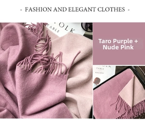 Detail of soft purple and pink cashmere scarf showing delicate tassels and woven texture