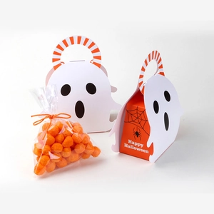 Detail of Halloween ghost candy boxes with spider web patterns and orange treats