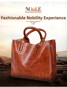 Close-up of vintage brown oil wax leather texture and stitching on the tote bag