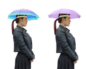 Detail of umbrella hats in rainbow and purple showing the elastic headband strap