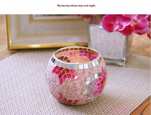 Macro shot of handmade pink mosaic glass candle holder with bead and mirror details