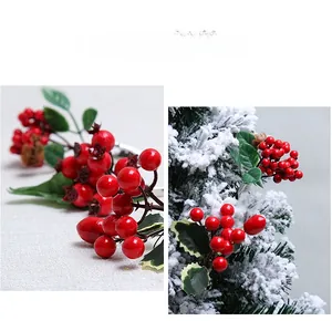 Detail of artificial red berry stems with green leaves and pine cones for Christmas DIY