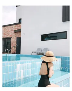 Detail view of a black backless halter swimsuit featuring a sleek and elegant fit