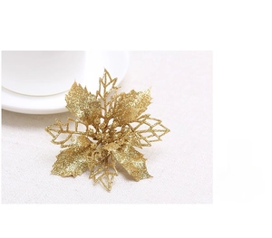 Close-up of a 10cm gold glitter hollow artificial Christmas flower for tree decoration