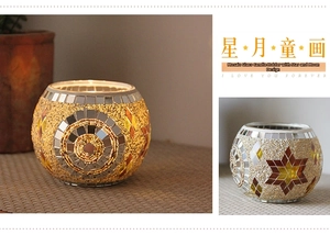 Macro shot of handmade mosaic glass candle holder with gold beads and star patterns