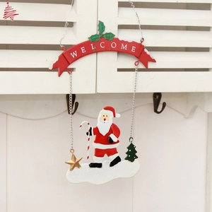Detail of metal Santa hanging ornament with Welcome banner and colorful festive pendants