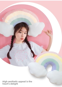 Rainbow cloud plush cushion with soft colorful gradient fabric and fluffy white accents