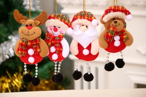 Detailed view of four plush Christmas ornaments featuring Santa, Snowman, Deer, and Bear