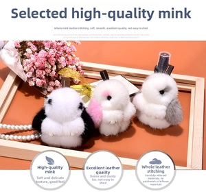 Detail of handmade mink fur bunny keychains in various colors with soft plush texture