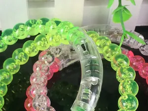 Macro shot of LED acrylic bubble bracelets in neon green and bright pink colors