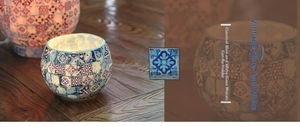 Macro view of blue and white mosaic glass candle holder with traditional porcelain style
