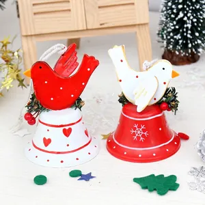 Christmas bird bell ornaments with red and white painted metal and jute rope hangers