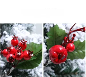 Detail of red Christmas berries with green leaves and a metal clip for DIY holiday wreaths