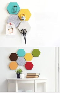 Detailed view of colorful hexagonal felt wall tiles showcasing keys and photo storage