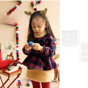 Close-up of cute brown reindeer antler headband for girls Christmas hair accessory